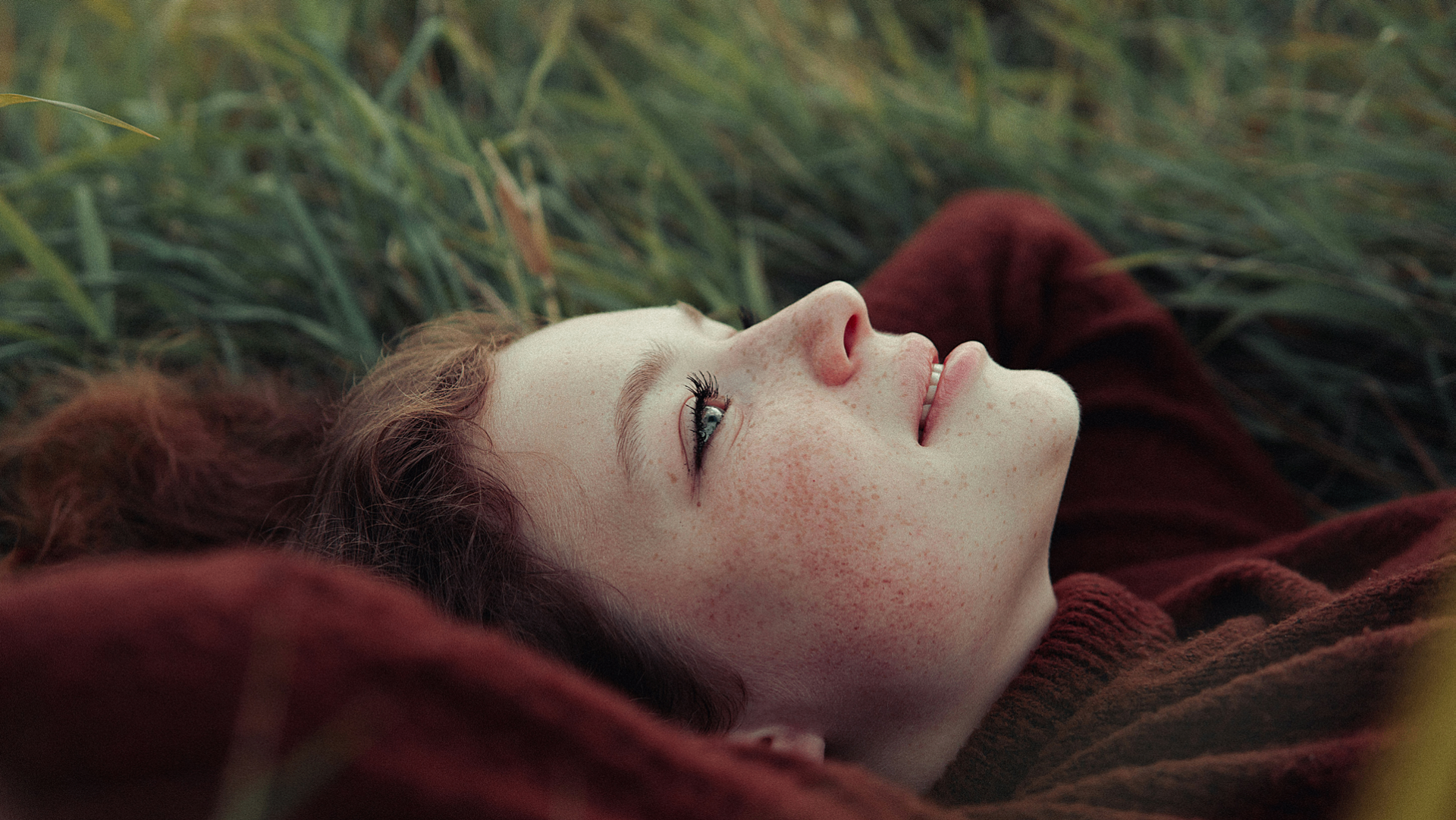 Woman lying in grass